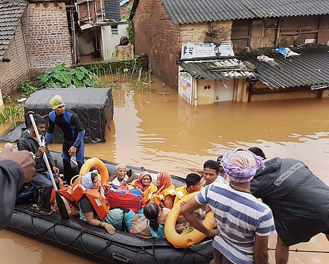 Indian Coast Guard personnel carry out rescue and relief operation at a flooded area in Kolhapur district of Maharashtra (Photo | PTI)
