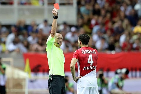 Referee Ruddy Buquet referred the incident to VAR who chose to send Fabregas for an early shower. | AP