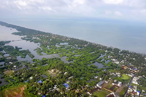 In this picture provided by the Indian Navy is seen the flooded coastline in the north of Kochi. (Photo | PTI)