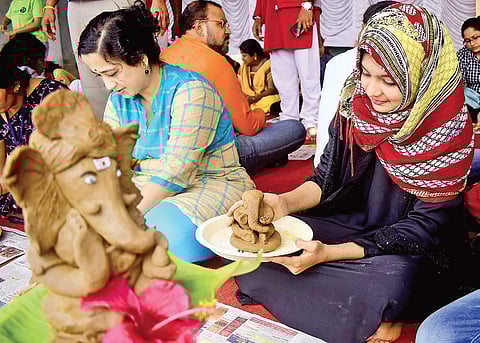 Volunteers learn the art of creating clay Ganeshas  Pandarinath B