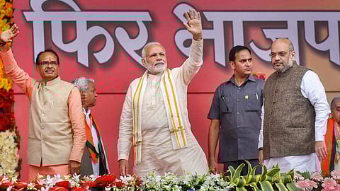 Former Madhya Pradesh CM Shivraj Singh Chouhan with PM Narendra Modi and Amit Shah. (Photo| PTI)