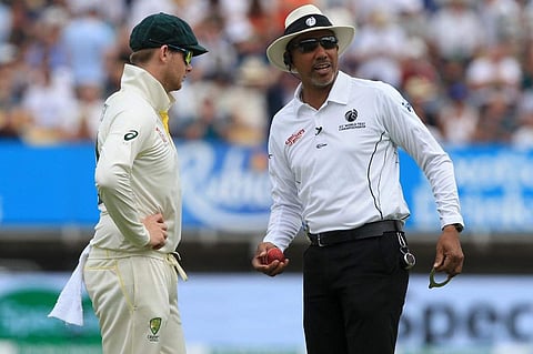 Umpire Joel WIlson checks the shape of the ball as Australia's Steve Smith (L) looks on. (Photo | AFP)