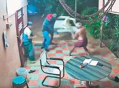 Screen grab of CCTV footage of the the couple fighting off the robbers | Express