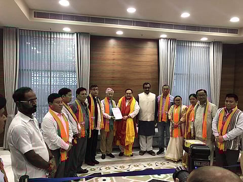 Sikkim Democratic Front MLAs join BJP in the presence of working president JP Nadda and general secretary Ram Madhav (Photo | Twitter/ @iamrohit2104)