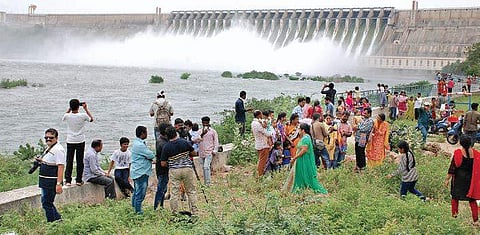Visitors enjoy the scenery as all gates of Nagarjuna Sagar are lifted (Photo |EPS)