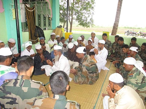 Soldiers of MLIRC centre with villagers in Belgavi. (Photo | Express)