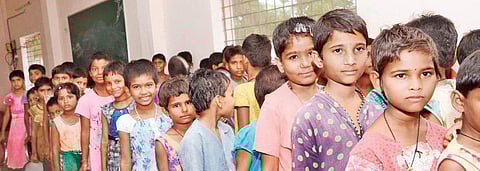 Students of the Tribal Girls Gurukul School with their new and controversial haircuts (Photo |EPS)