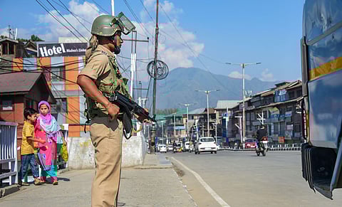 A CRPF jawan stands guard in Kashmir. (File Photo | PTI)