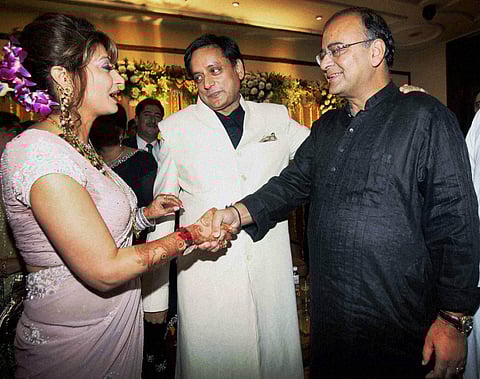 BJP leader Arun Jaitley greets newly wedded couple Shashi Tharoor and Sunanda Pushkar at their reception party in New Delhi in 2010. (File | PTI)