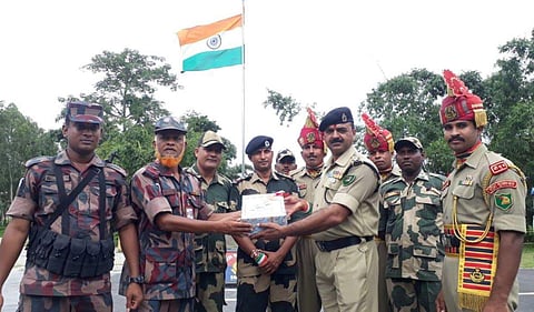 Sweets exchanged at India-Bangladesh border between Border Security Force (BSF) and Border Guards Bangladesh (BGB) (Photo | ANI)