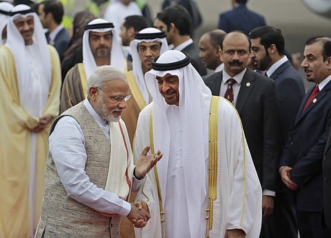 Indian Prime Minister Narendra Modi, left, gestures as he receives Abu Dhabi's Crown Prince, Sheikh Mohammed bin Zayed Al Nahyan at the airport in New Delhi, India. (Photo | AP)