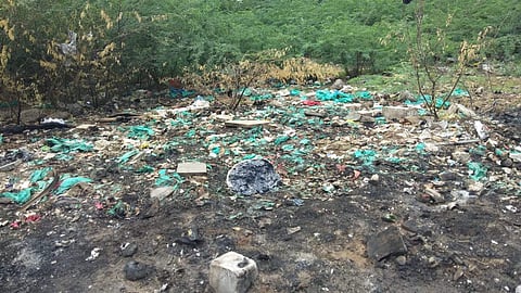 Biomedical waste dumped and burnt on the banks of Adyar River as found by a local activist on Thursday