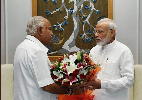 Karnataka Chief Minister BS Yediyurappa with Prime Minister Narendra Modi (Photo | Twitter @BSYBJP)