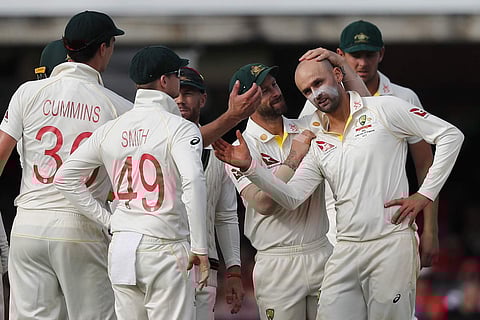 Australia's Nathan Lyon celebrates with team mates after taking the wicket of England's Stuart Broad during the second day of the second Ashes test match between England and Australia at Lord's cricket ground in London. (Photo | AP)