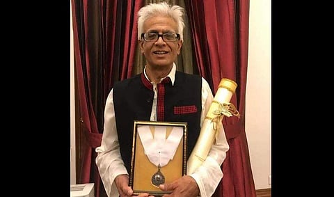 Tez Hazarika with the Bharat Ratna awarded posthumously to his father, legendary singer-musician Bhupen Hazarika. (Photo | EPS)