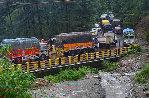 Vehicles stuck on a road following a landslide due to heavy monsoon rain in Shimla. (Photo | PTI)