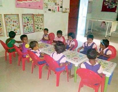Children with multi-purpose desks at a centre