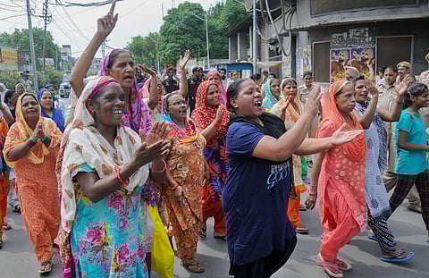 Members of Guru Ravidas Sabha Punjab during a protest march over demolishment of Guru Ravidas temple in Delhi in Amritsar. (Photo | PTI)