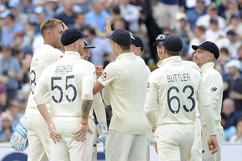 England players sporting shirts with numbers and names| AP