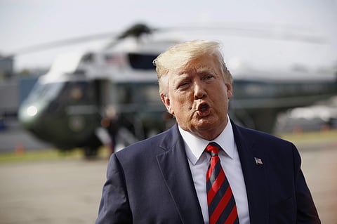 President Donald Trump speaks with reporters before boarding Air Force One at Morristown Municipal Airport in Morristown, N.J., Sunday, Aug. 18, 2019. | AP