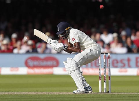 England's Jofra Archer ducks a bouncer off the bowling of Australia's Pat Cummins during the second Ashes Test. (Photo | AP)