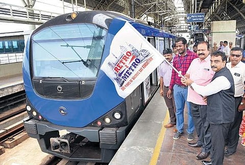 Vignesh Kumar J, senior vice-president, Marketing, Express Publications (Madurai), and  S Pandiyan, joint director and PR officer, CMRL, inaugurate ‘Retro to Metro’ at Koyambedu Metro station in Chennai on Thursday | R Satish Babu
