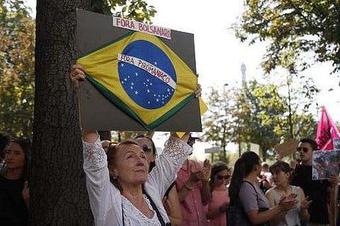 Climate activists demonstrate in front of Brazil's ambassy in France, on August 23, 2018 in Paris, to urge Brazilian president to do more to halt the fires in the Amazon rainforest. (Photo | AFP)