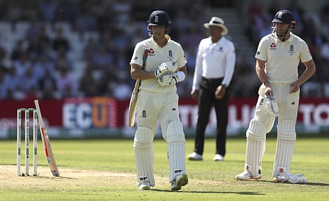 England's Joe Denly walks from the field after he was dismissed for 12 runs as teammate Jonny Bairstow, right, watches. (Photo | AP)
