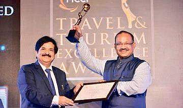 Tourism Minister Jyoti Prakash Panigrahi receiving award at a function in New Delhi