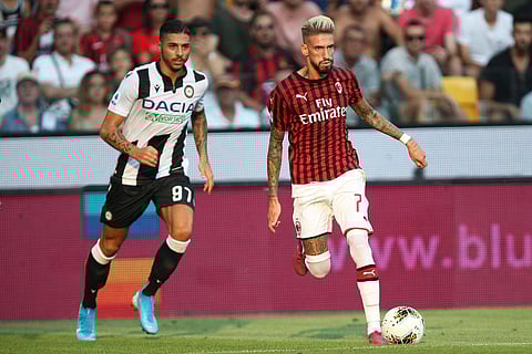 Udinese's Giuseppe Pezzella, left, and Milan's Samuel Castillejo vie for the ball during the Italian Serie A soccer match between Udinese and AC Milan at the Friuli stadium in Udine, Italy. (Photo | AP)