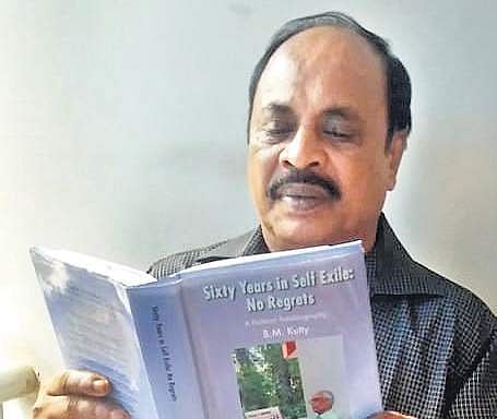 Mohammed Kutty reading the autobiography of B M Kutty at his residence in Tirur