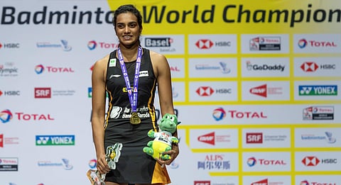Gold-medallist PV Sindhu after winning her women's singles final match against Japan's Nozomi Okuhara at the BWF Badminton World Championships in the St. Jakobshalle in Basel. (Photo | AP)