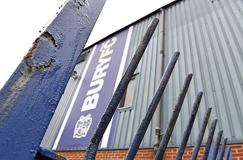 Rusty gates at Bury Football Club's Gigg Lane stadium in Bury, England, Wednesday Aug. 28, 2019. Bury, one of the oldest clubs in English soccer, has been expelled from the English Football League after 125 years of membership following its failure to fin