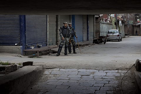 Indian paramilitary soldiers stand guard at a closed market in central Srinagar, Tuesday, August 27, 2019. | AP