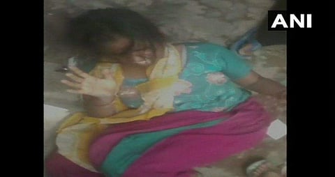 The woman was thrashed by a mob in Ghaziabad as child lifting rumours continue to rise in the state. (Photo | ANI)