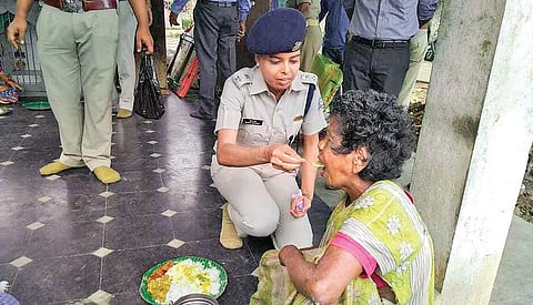 SP Sarah Sharma feeding a leprosy patient at Maharaja’s Diamond Jubilee Rehabilitation Centre in Parlakhemundi on Wednesday  | Express