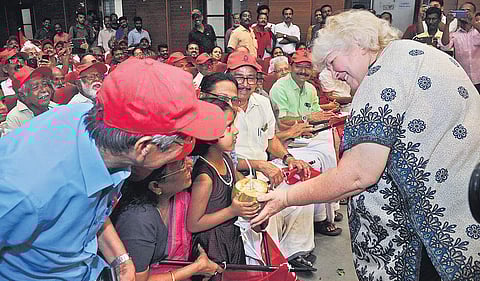 Dr Aleida Guevara giving a tender coconut to a child on Friday at a function marking the Cuban Solidarity Day |  A Sanesh