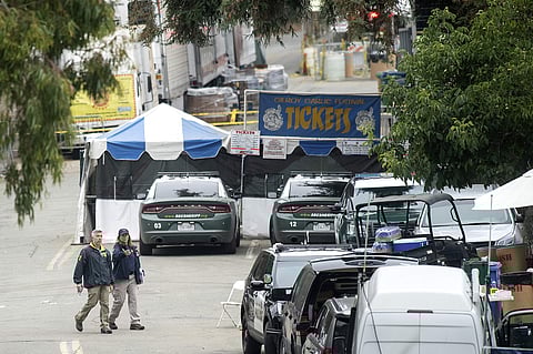 In this July 29, 2019 file photo FBI personnel pass a ticket booth at the Gilroy Garlic Festival in Calif., the morning after a gunman killed multiple people and wounded over a dozen others. (Photo | AP)