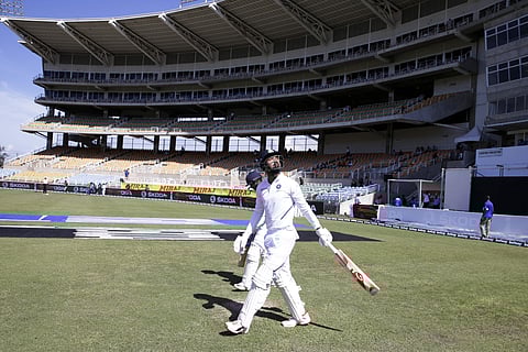 India's openers KL Rahul, front, and Mayank Agarwal walk to their creases for day one of the second Test cricket match against West Indies. (Photo | AP)
