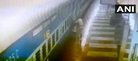 Screengrab of the RPF's daring act on CCTV which has gone viral over social media. (Photo | ANI)