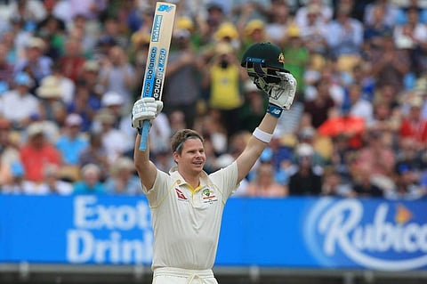 Australia's Steve Smith celebrates after reaching his century during play on the fourth day of the first Ashes cricket Test match between England and Australia at Edgbaston in Birmingham. (Photo | AFP)