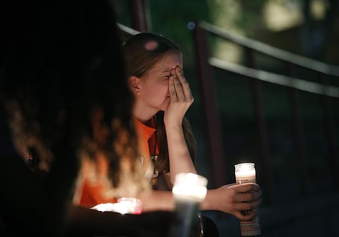 Sherie Gramlich reacts during a vigil for victims of a mass shooting that occurred earlier in the day at a shopping complex Saturday, Aug. 3, 2019, in El Paso, Texas. (Photo | AP)