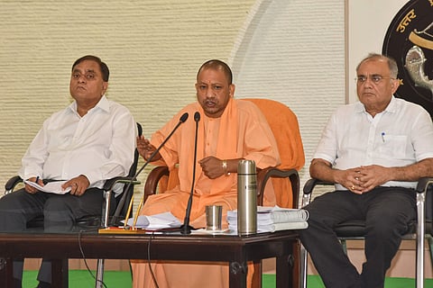 Uttar Pradesh Chief Minister Yogi Adityanath addresses a press conference at his residence in Lucknow on Aug 4 2019. Also seen are UP DGP OP Singh and Chief Secretary Anoop Kumar Pandey. (Photo | PTI)