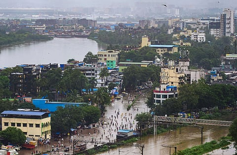 A view of the waterlogged tracks and between Sion and Kurla and surrounding areas after the water level of Mithi river rose due to incessant monsoon rains in Mumbai, Aug. 4 2019. (Photo | PTI)
