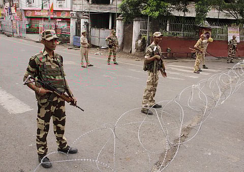 Security personnel stand guard during restrictions in Jammu. (Photo| PTI)