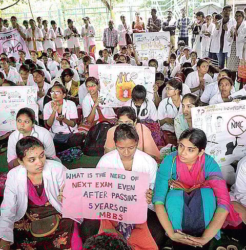 Medical students stage protest against NMC Bill in Vizag on Tuesday (Photo |EPS)