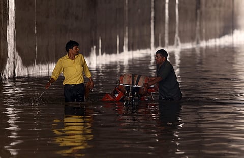 Vehicle wades through flooded underpass near Azad Market after heavy rainfall in New Delhi. (Photo | Arun Kumar, EPS)