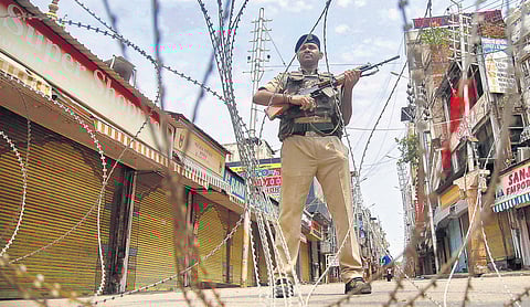 CRPF personnel stand guard during restrictions at Raghunath Bazar in Jammu  (File photo | PTI)