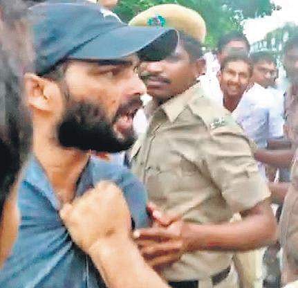 A video-grab of the officer slapping a doctor during protests