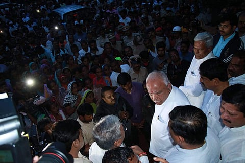 Karnataka CM B S Yeddyurappa speaking to the press at one of the flood-hit regions. (Photo | EPS)